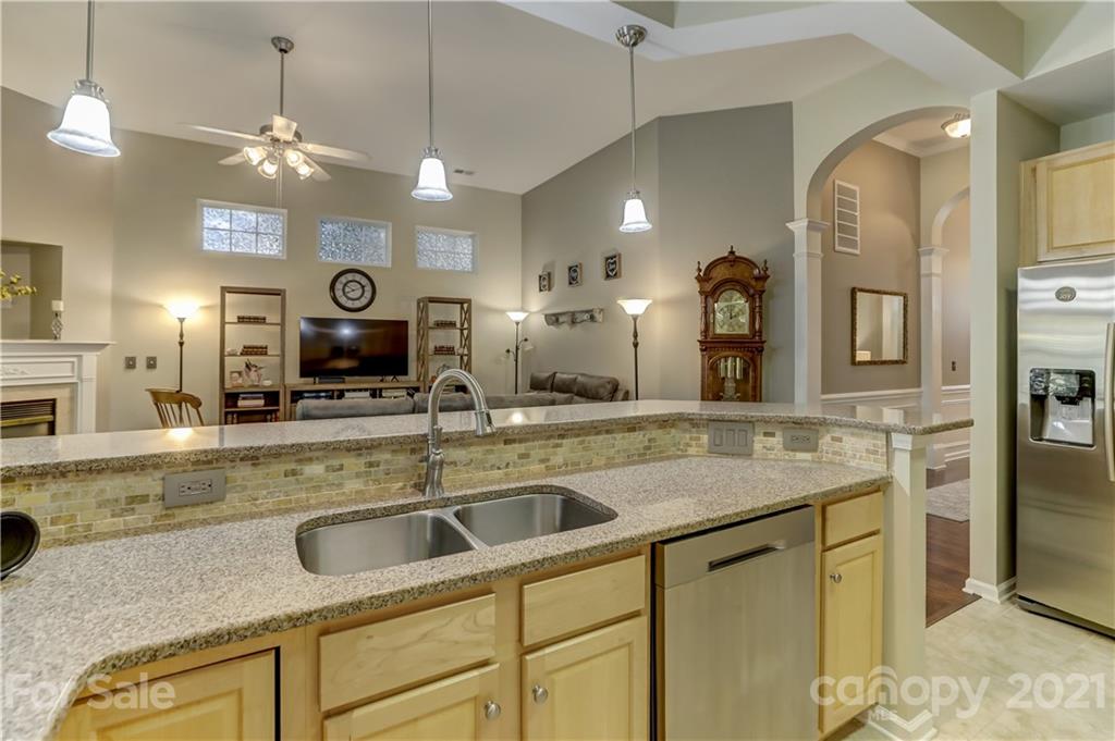 146 Whitley Mills Road Fort Mill, SC 29708 - Photo 15 of 37 a kitchen with a sink and a refrigerator