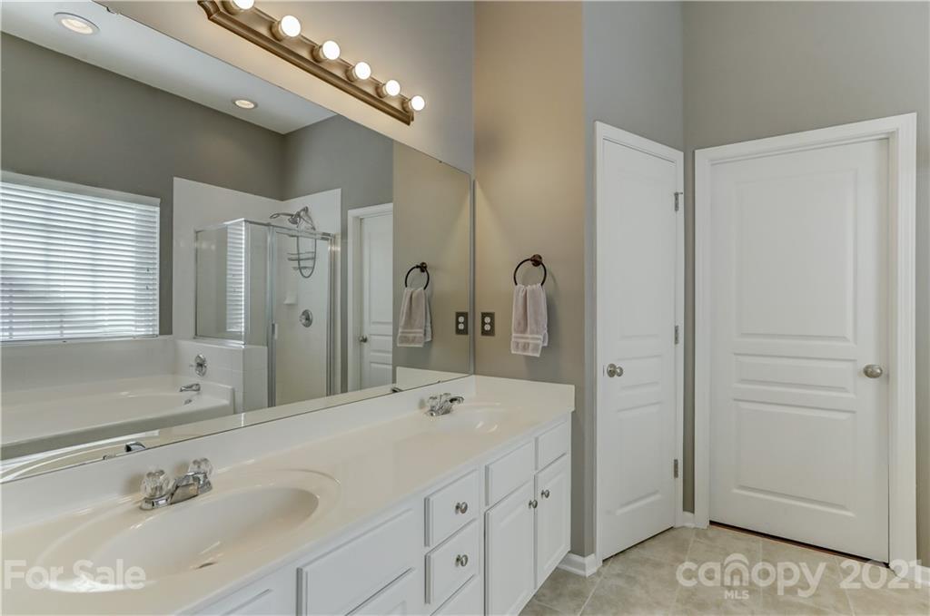 146 Whitley Mills Road Fort Mill, SC 29708 - Photo 22 of 37 a bathroom with a sink double vanity and a mirror