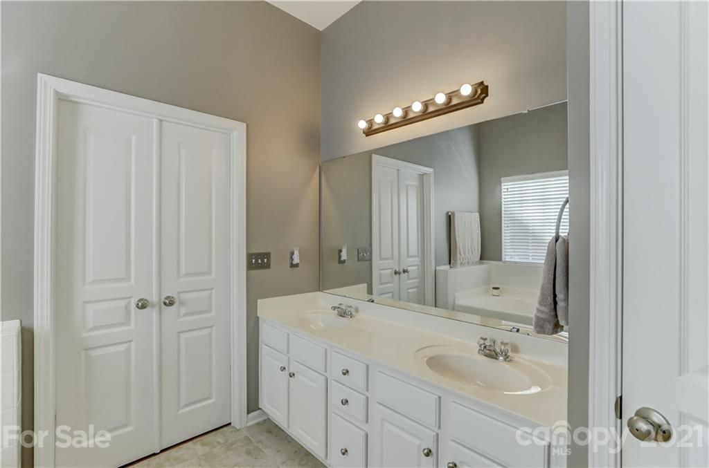 146 Whitley Mills Road Fort Mill, SC 29708 - Photo 23 of 37 a bathroom with a double vanity sink and a mirror