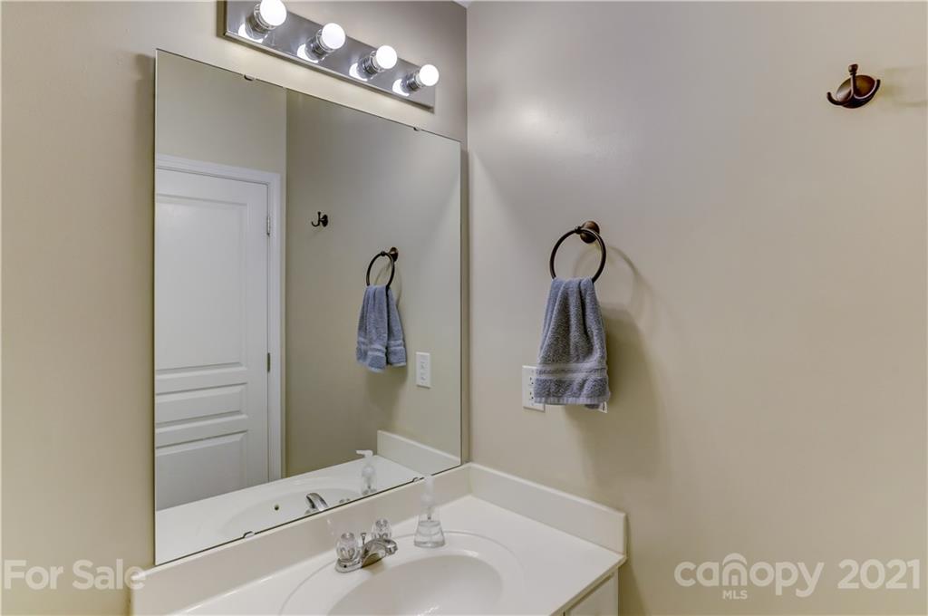 146 Whitley Mills Road Fort Mill, SC 29708 - Photo 31 of 37 a bathroom with a sink and mirror