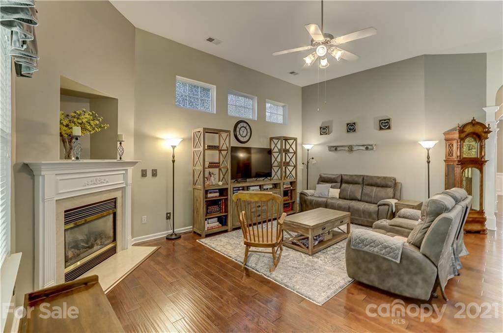 146 Whitley Mills Road Fort Mill, SC 29708 - Photo 8 of 37 a living room with furniture and a fireplace