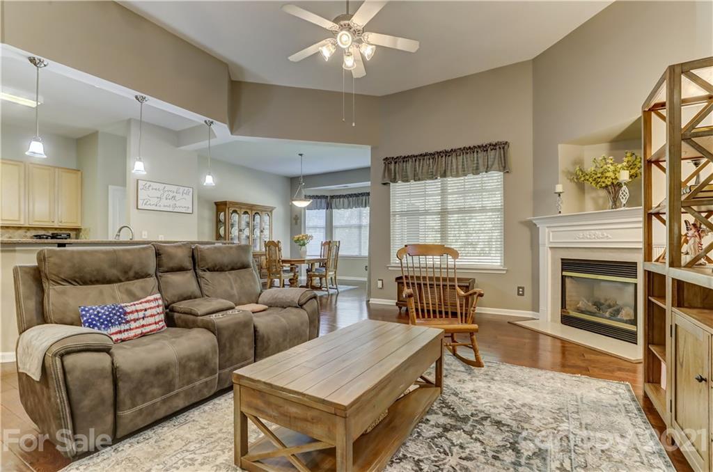 146 Whitley Mills Road Fort Mill, SC 29708 - Photo 10 of 37 a living room with furniture a fireplace and a flat screen tv