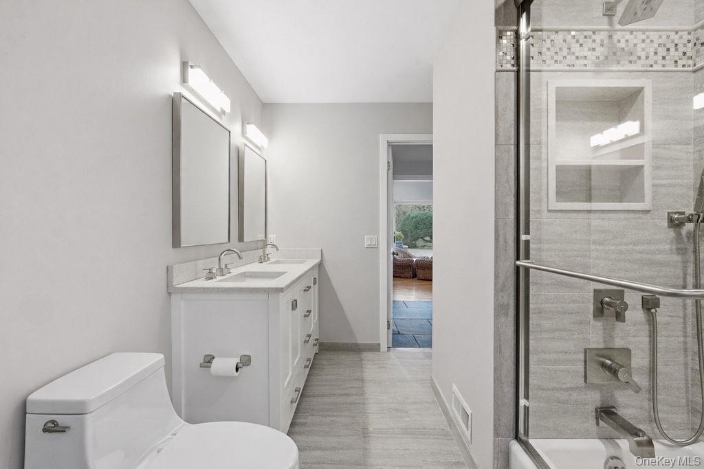 3 Mallard Lane Remsenburg, NY 11960 - Photo 26 of 40 a bathroom with a toilet sink and shower