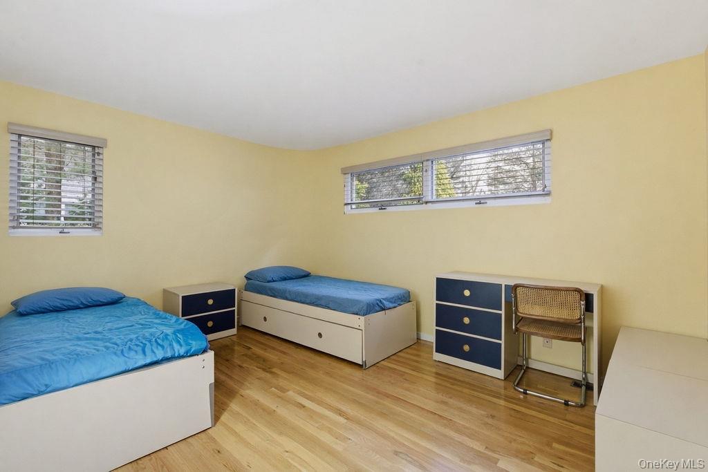 3 Mallard Lane Remsenburg, NY 11960 - Photo 27 of 40 a bedroom with a bed and a dresser