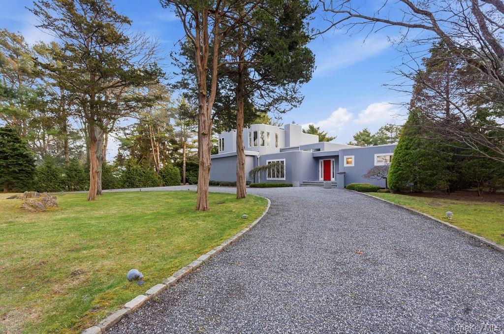 3 Mallard Lane Remsenburg, NY 11960 - Photo 3 of 40 a view of a house with a yard and tree s