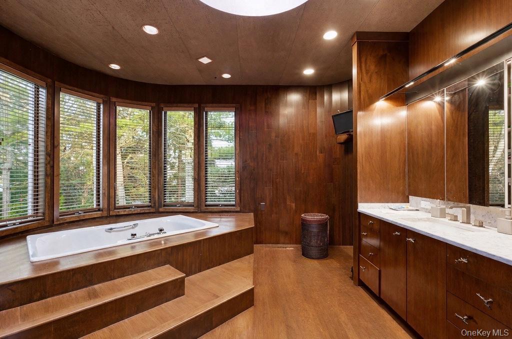 3 Mallard Lane Remsenburg, NY 11960 - Photo 32 of 40 a spacious bathroom with a large tub and sink