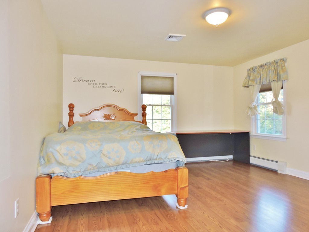 3 Cromwell Lane Rochester, MA 02770 - Photo 12 of 15 a bedroom with a bed and window