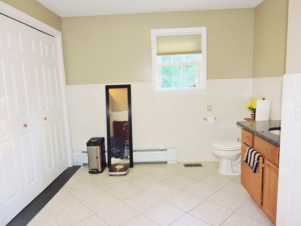3 Cromwell Lane Rochester, MA 02770 - Photo 4 of 15 a bathroom with a sink a toilet and a mirror