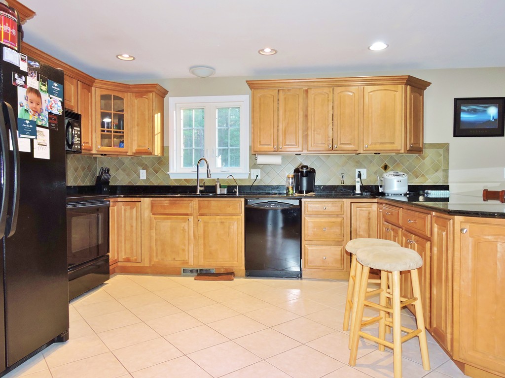 3 Cromwell Lane Rochester, MA 02770 - Photo 6 of 15 a kitchen with stainless steel appliances granite countertop a sink and a stove
