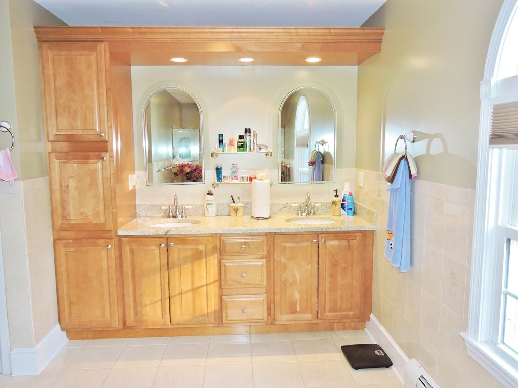 3 Cromwell Lane Rochester, MA 02770 - Photo 10 of 15 a en suite bathroom with a sink mirror and vanity