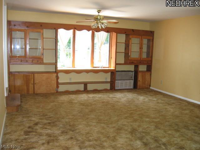461 Howland Wilson Road Northeast Warren, OH 44484 - Photo 5 of 13 One end of the living room/dining room combo with built-ins; this room is 15' X 23'