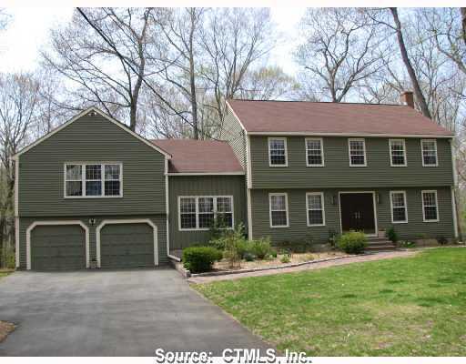 53 Colonial Road Madison, CT 06443 - Photo 1 of 1 a front view of a house with garden