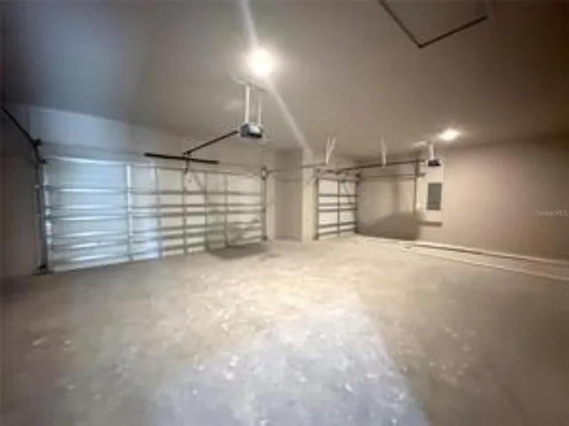 a bathroom with a double vanity sink and mirror