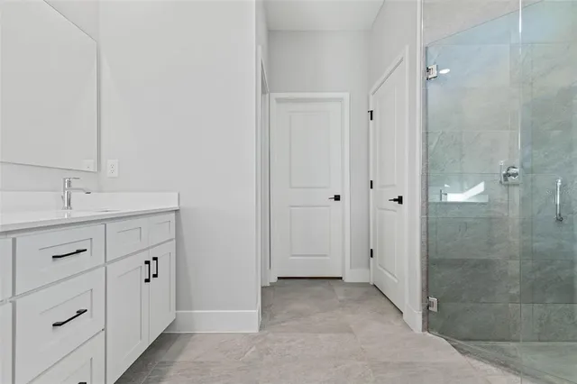 a bathroom with a double vanity sink and mirror