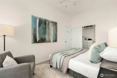 a bedroom with a bed and a couch