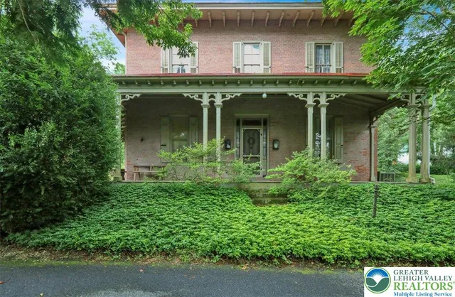 front view of a house with potted plants