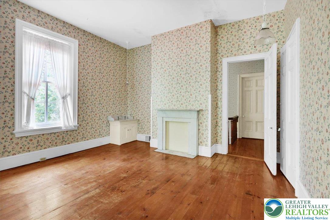 1670 Moselem Spring Road Hamburg, PA 19526 - Photo 29 of 50 a view of an empty room with wooden floor and a window