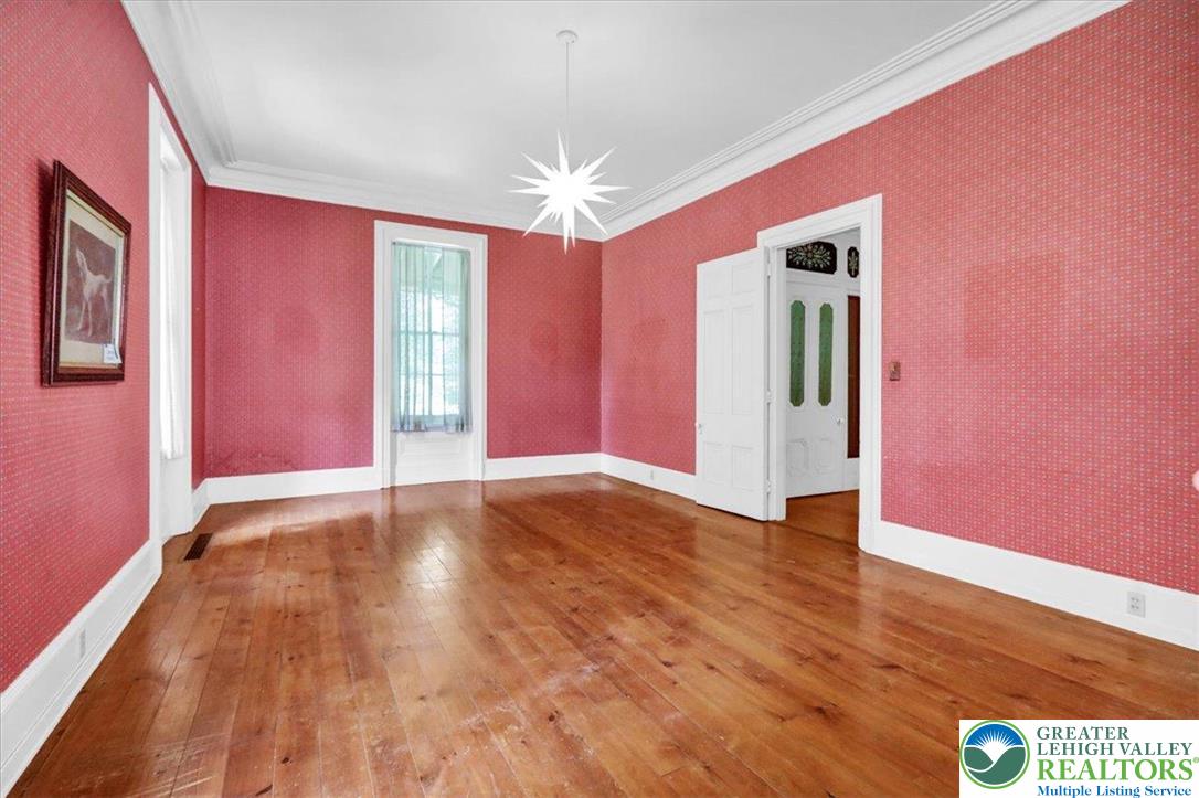 1670 Moselem Spring Road Hamburg, PA 19526 - Photo 42 of 50 a view of an empty room with window and wooden floor
