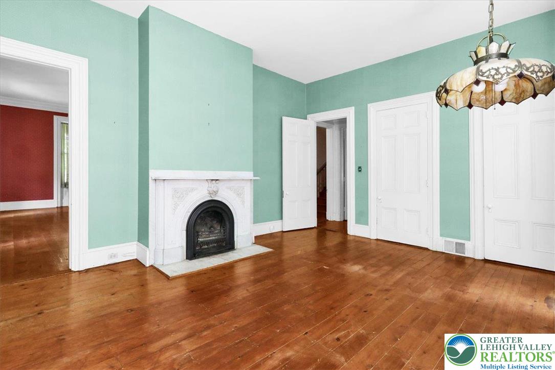 1670 Moselem Spring Road Hamburg, PA 19526 - Photo 43 of 50 a view of a livingroom with a fireplace wooden floor and a chandelier