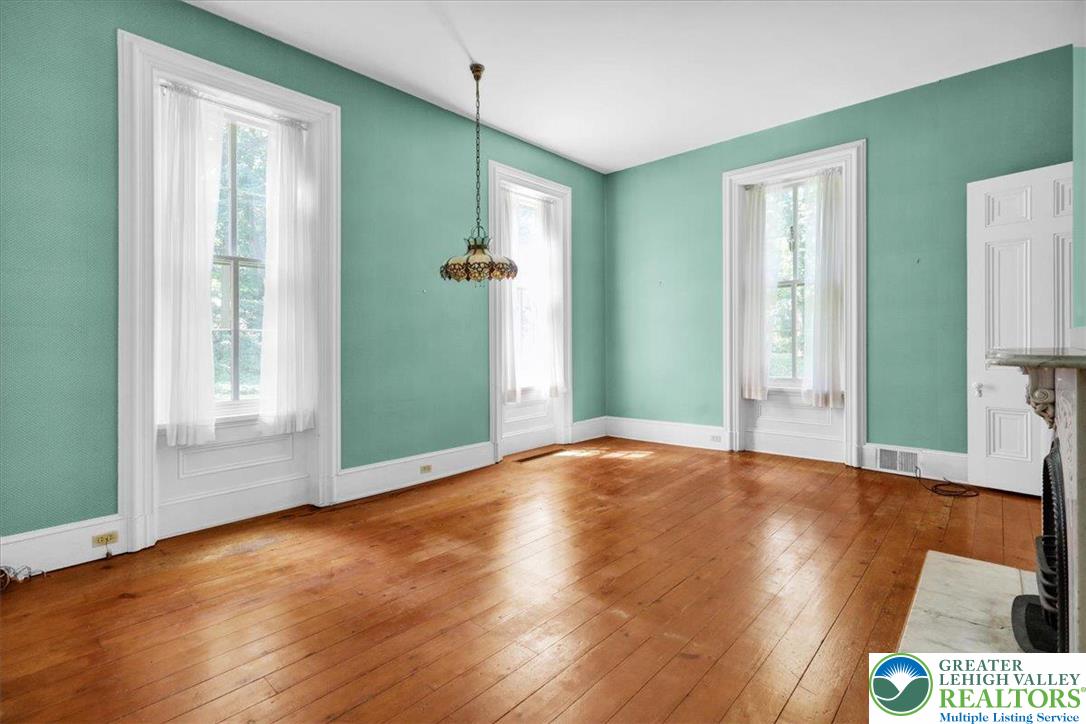 1670 Moselem Spring Road Hamburg, PA 19526 - Photo 44 of 50 a view of an empty room with wooden floor and a window