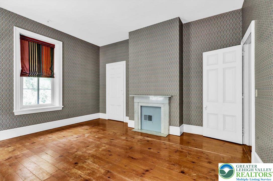 1670 Moselem Spring Road Hamburg, PA 19526 - Photo 47 of 50 a view of empty room with window and fireplace