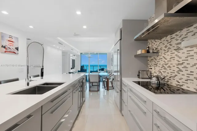 a kitchen with sink cabinets and stove