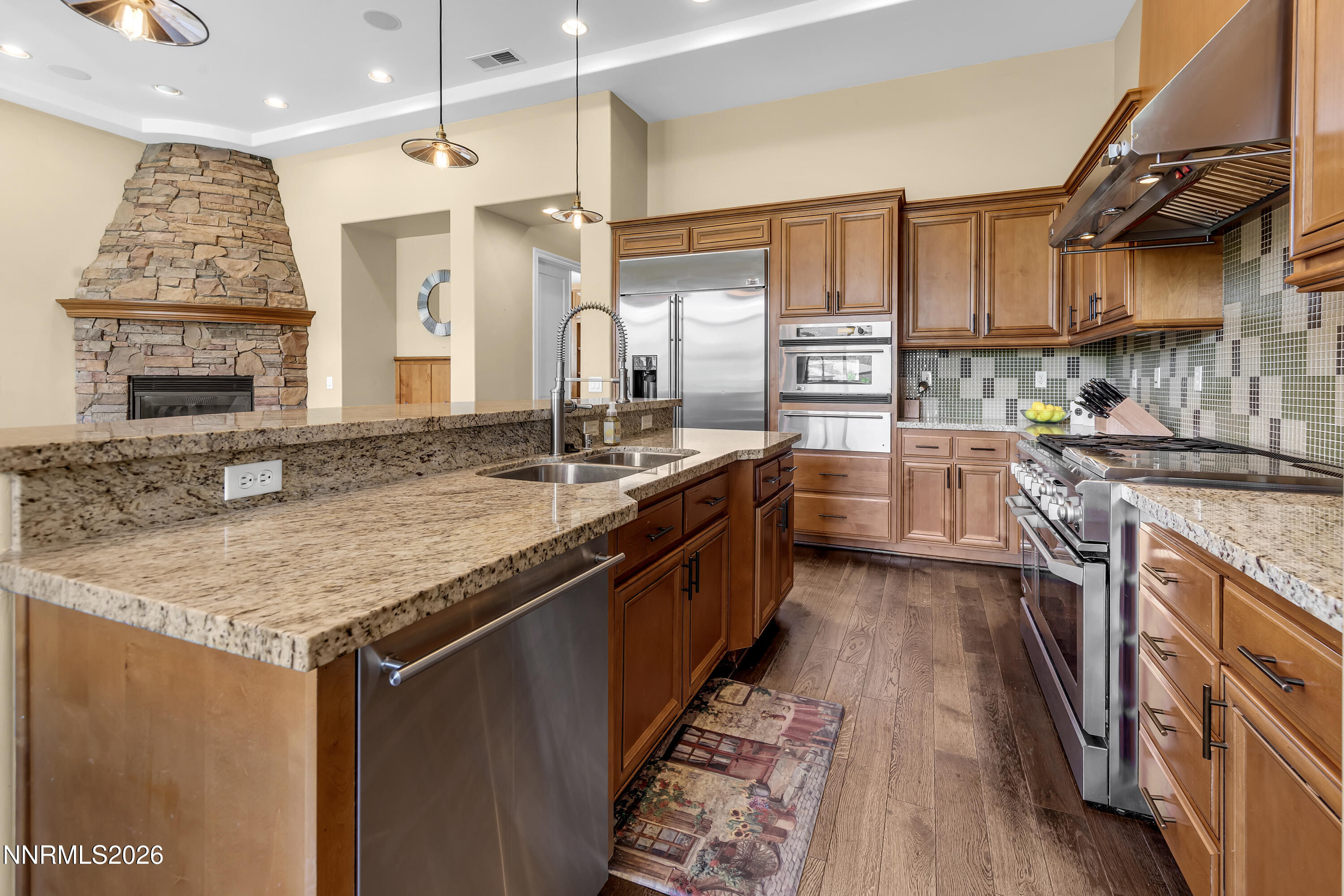 1898 Laurel Ridge Drive Reno, NV 89523 - Photo 29 of 87 a kitchen with stainless steel appliances granite countertop a sink stove and refrigerator