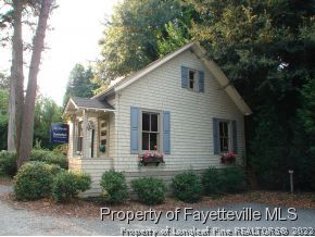 105 Magnolia Road Pinehurst, NC 28374 - Photo 13 of 25 a front view of a house with garden