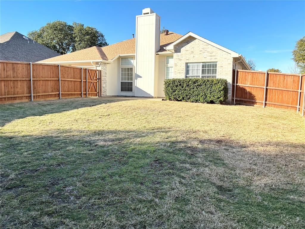 1002 Morningside Lane Allen, TX 75002 - Photo 14 of 18 a view of a house with a yard and garage