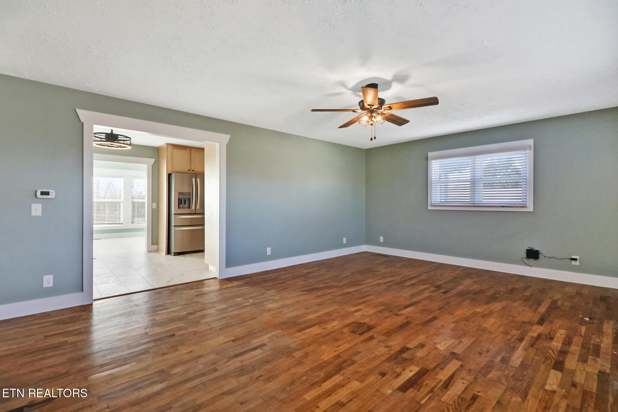 1065 Old Grimsley Road Grimsley, TN 38565 - Photo 11 of 43 a view of an empty room with window and wooden floor