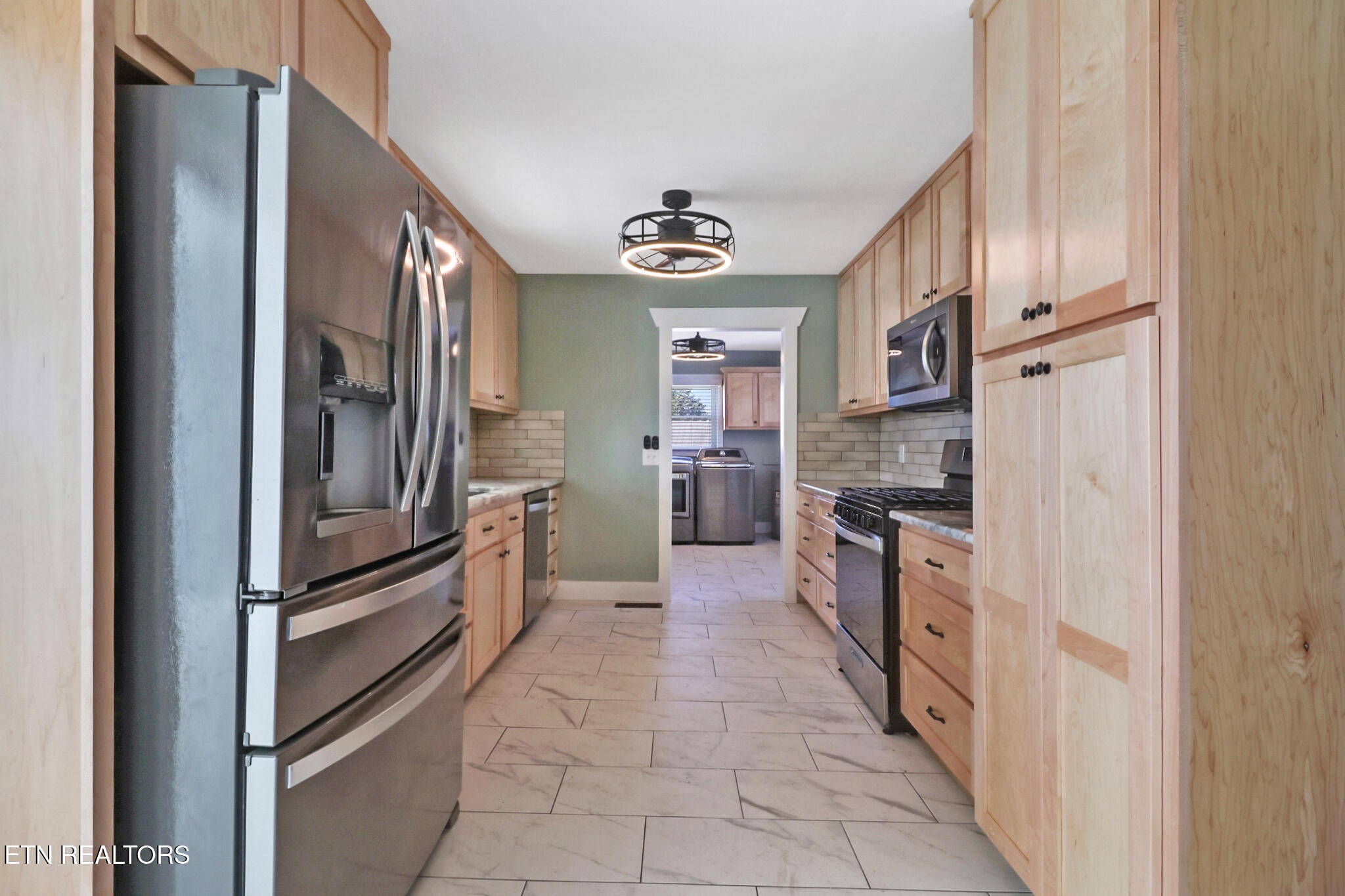 1065 Old Grimsley Road Grimsley, TN 38565 - Photo 15 of 43 a kitchen with stainless steel appliances granite countertop a refrigerator and a sink