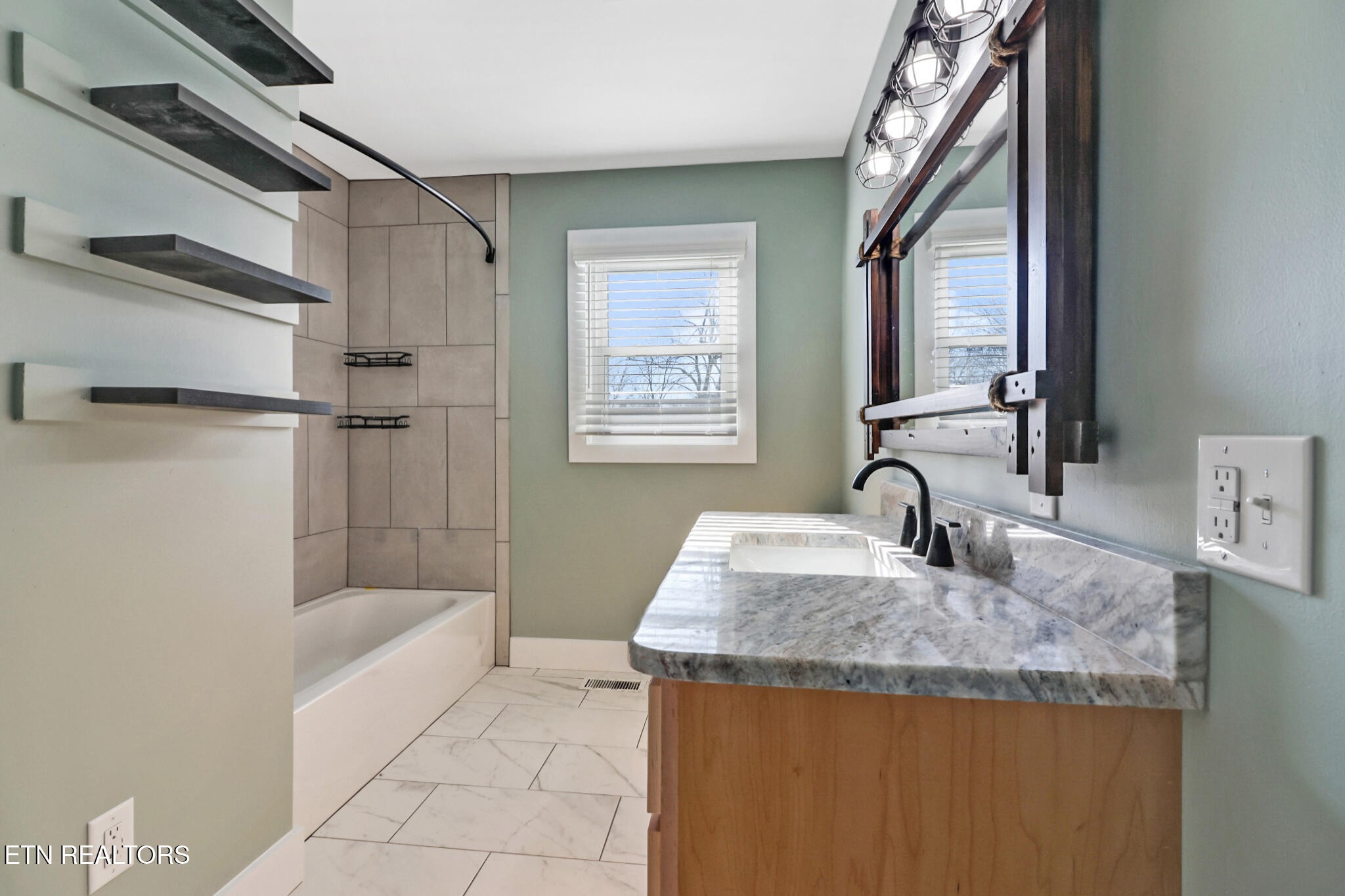 1065 Old Grimsley Road Grimsley, TN 38565 - Photo 23 of 43 a bathroom with a granite countertop sink a mirror and shower