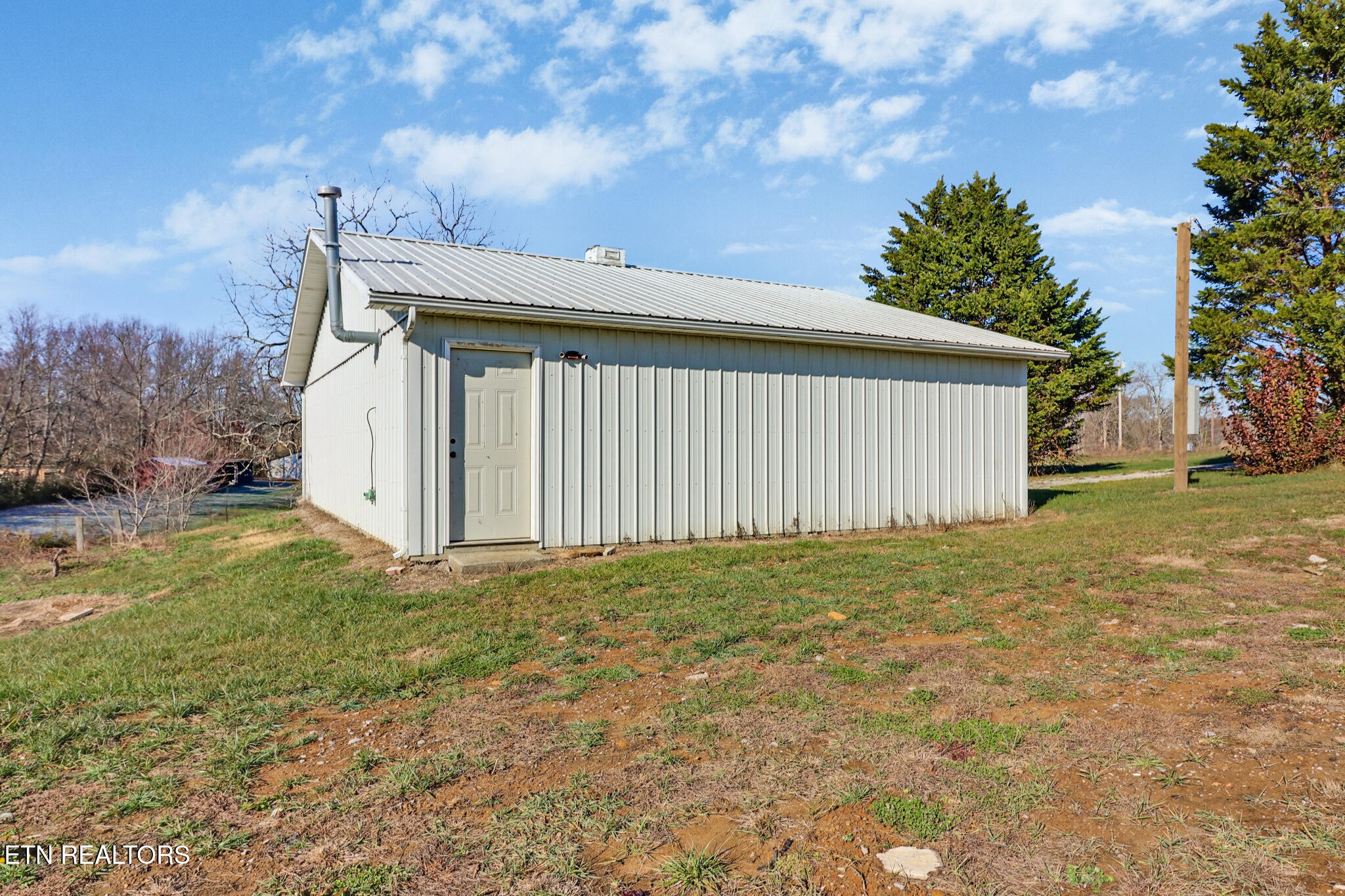 1065 Old Grimsley Road Grimsley, TN 38565 - Photo 30 of 43 a backyard of a house with lots of green space