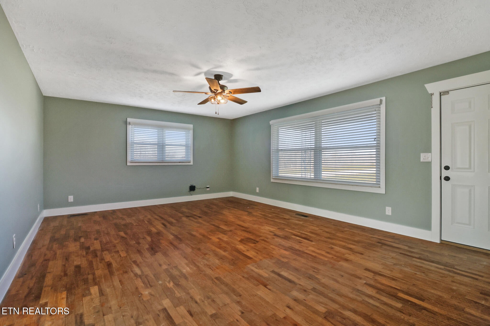 1065 Old Grimsley Road Grimsley, TN 38565 - Photo 9 of 43 a view of an empty room with a window and wooden floor