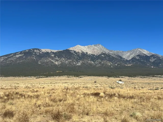 a view of ocean with mountains