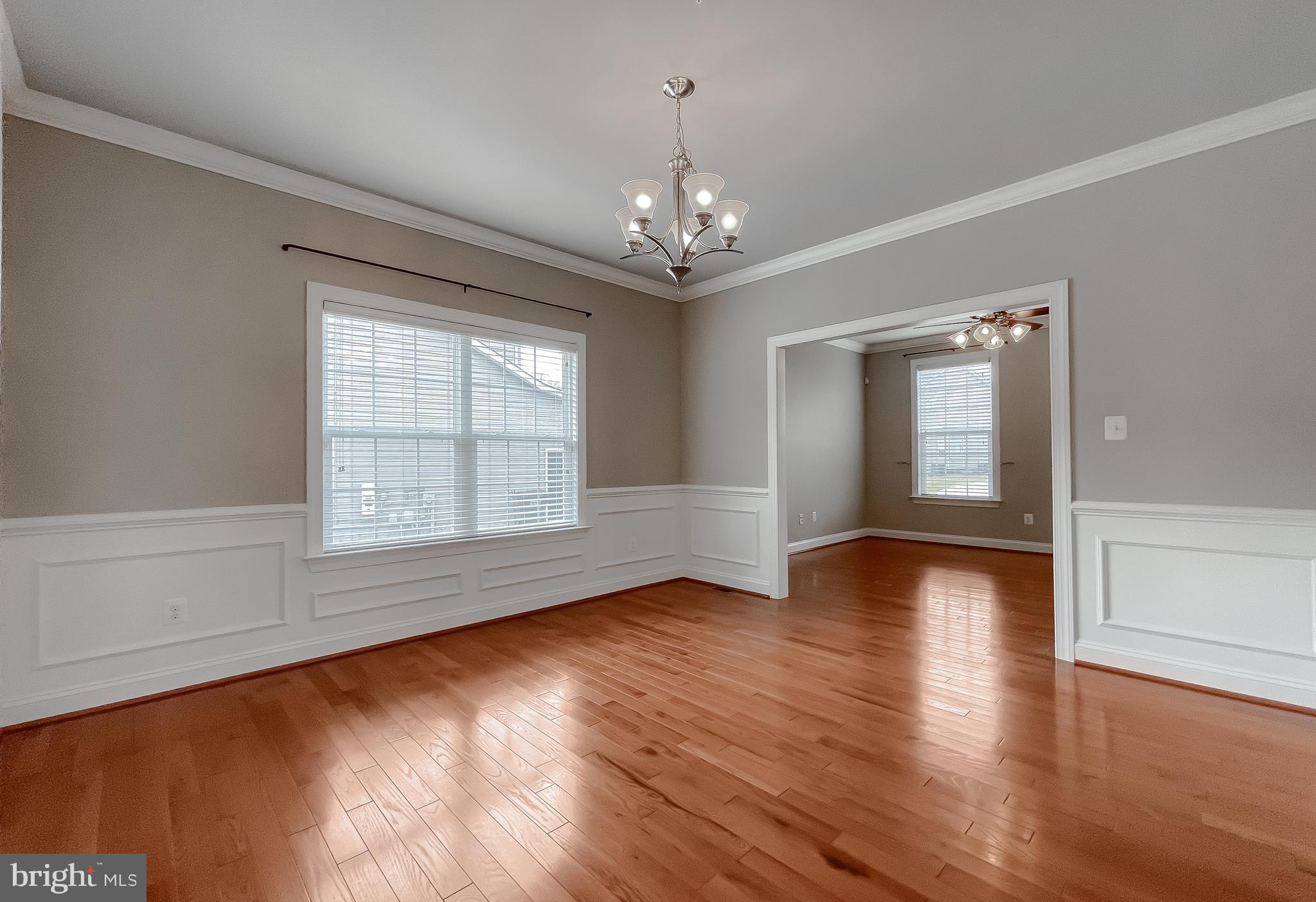 43361 Quail Street Hollywood, MD 20636 - Photo 11 of 73 a view of an empty room with wooden floor and a window