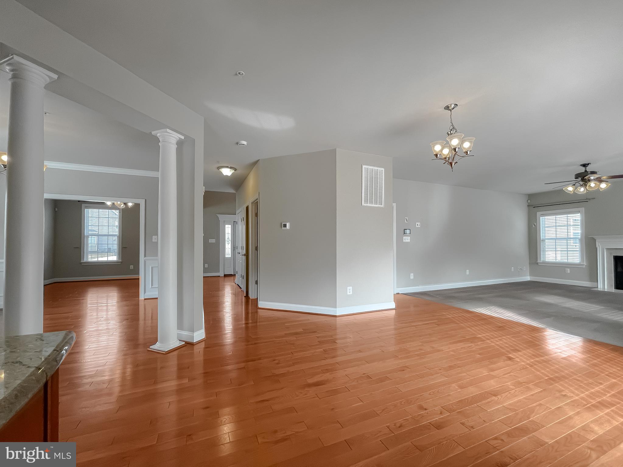 43361 Quail Street Hollywood, MD 20636 - Photo 17 of 73 a view of a hallway with wooden floor and a chandelier