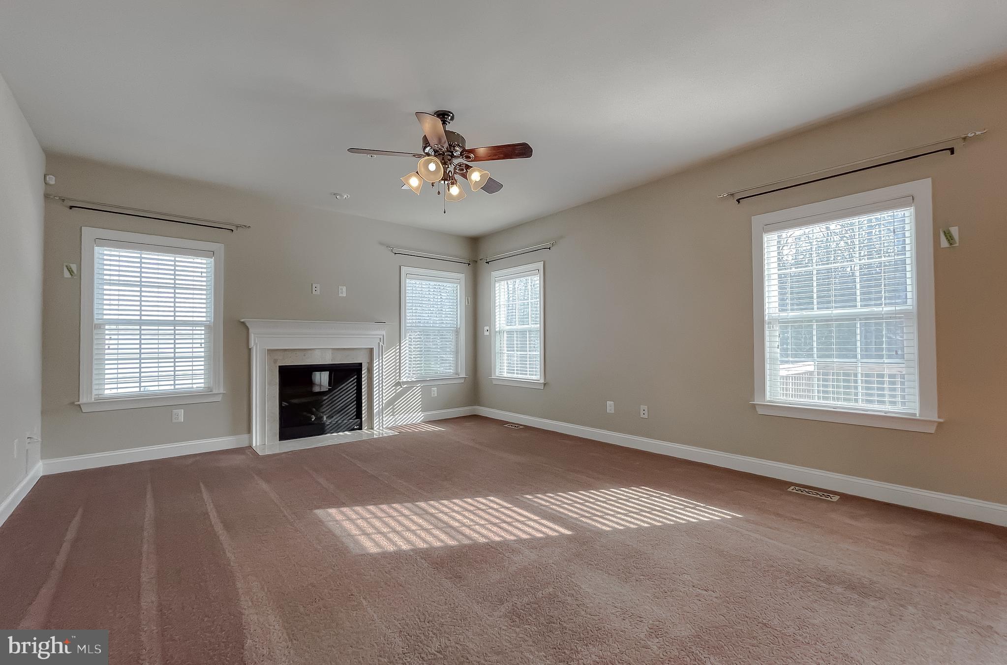 43361 Quail Street Hollywood, MD 20636 - Photo 18 of 73 an empty room with windows and fireplace