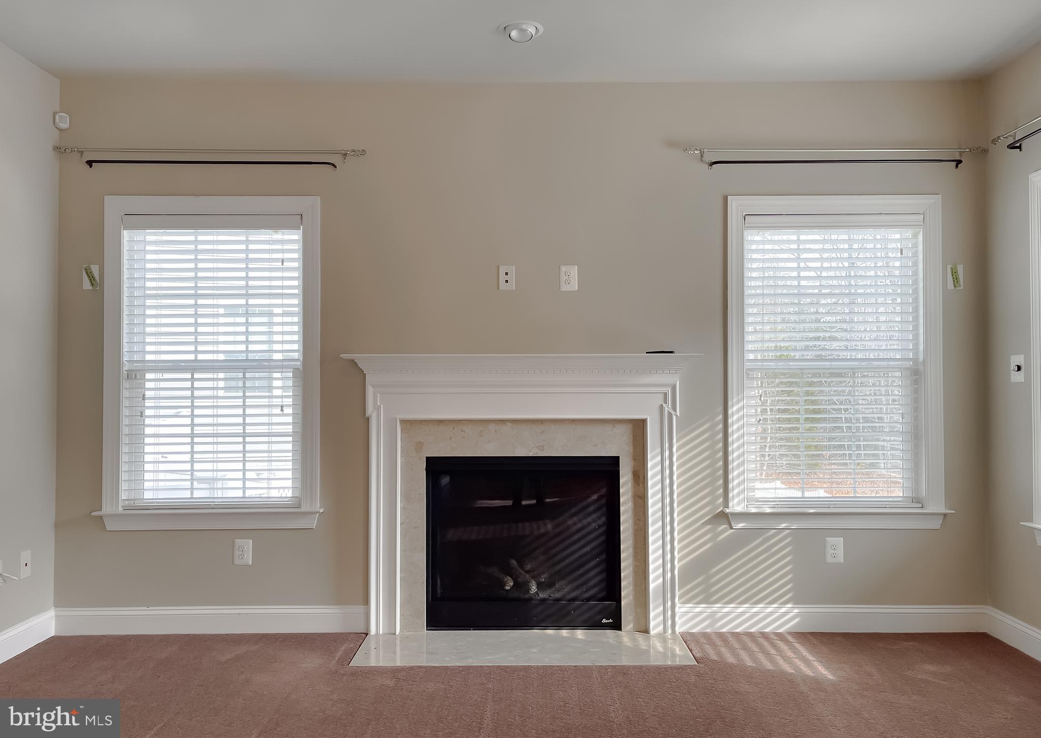 43361 Quail Street Hollywood, MD 20636 - Photo 19 of 73 a living room with a fireplace and window