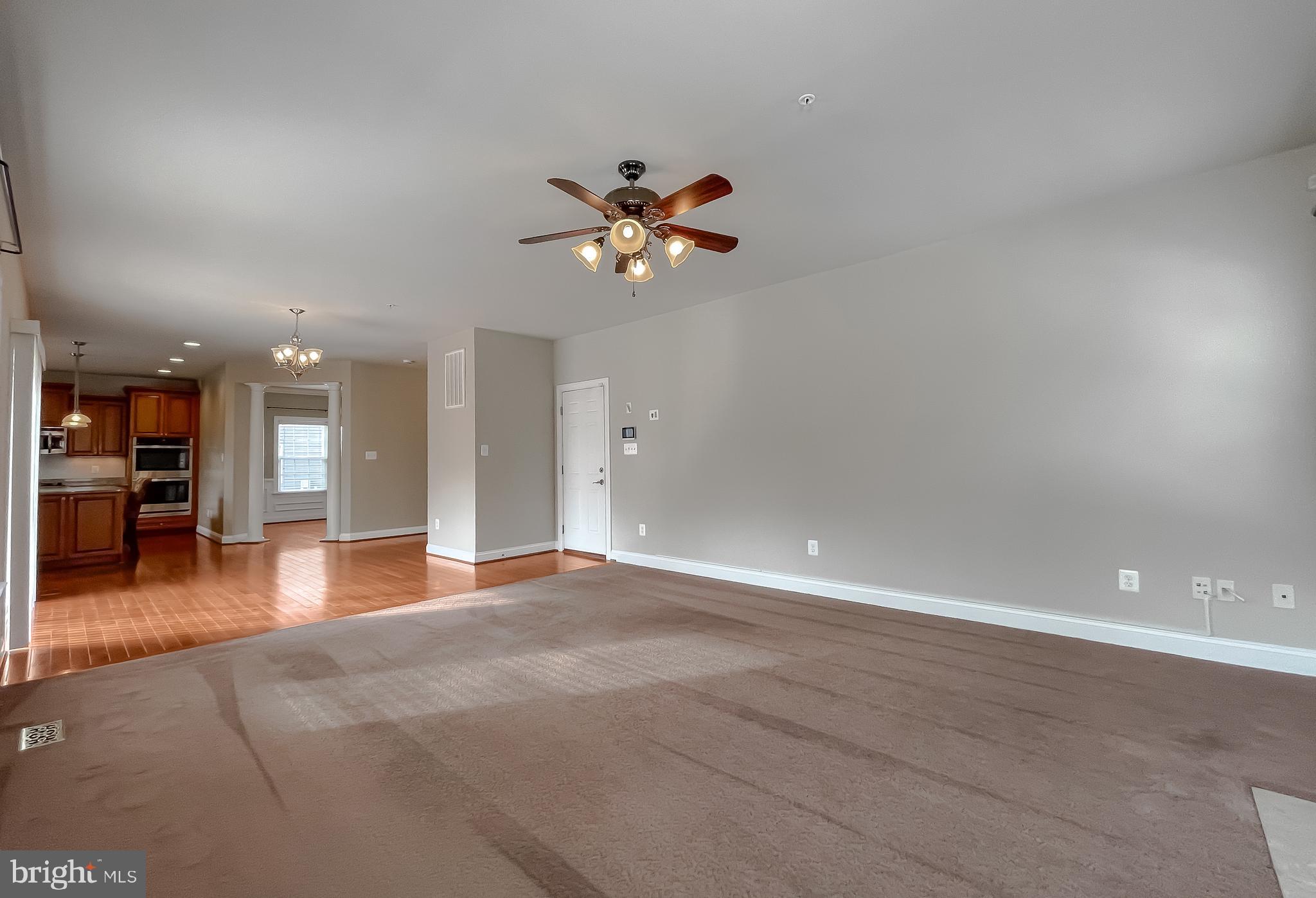 43361 Quail Street Hollywood, MD 20636 - Photo 20 of 73 a view of a kitchen with a sink and a chandelier fan