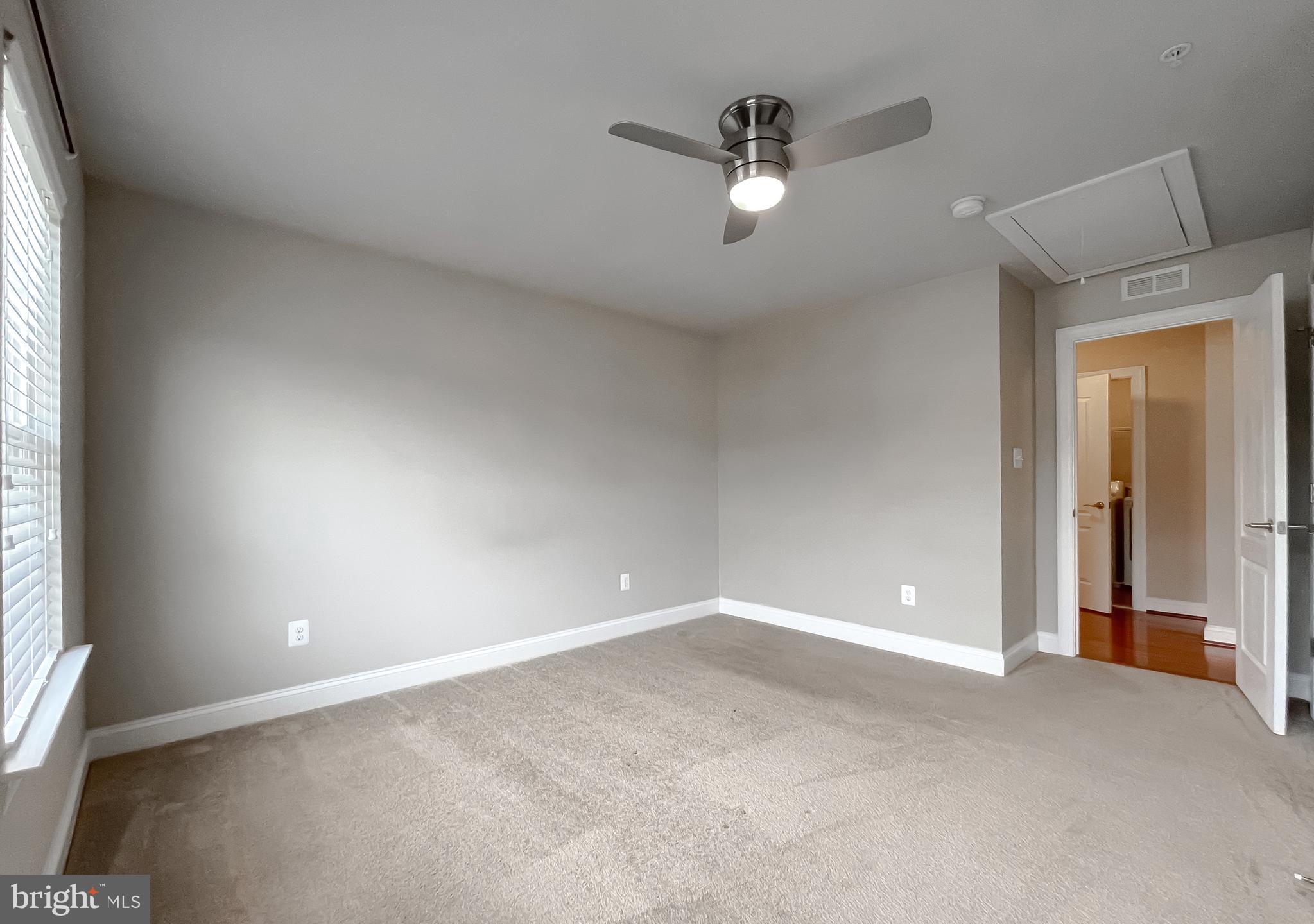43361 Quail Street Hollywood, MD 20636 - Photo 29 of 73 an empty room with a window and a fan