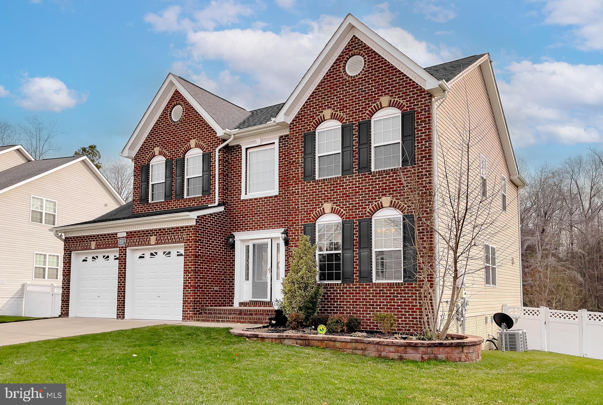 43361 Quail Street Hollywood, MD 20636 - Photo 3 of 73 a front view of a house with a yard