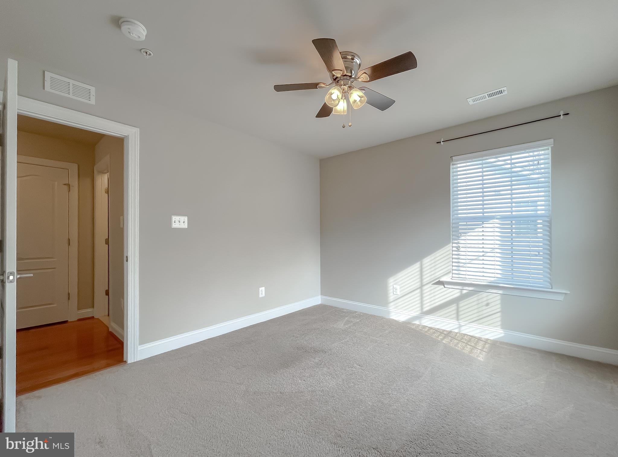 43361 Quail Street Hollywood, MD 20636 - Photo 31 of 73 an empty room with chandelier fan and windows