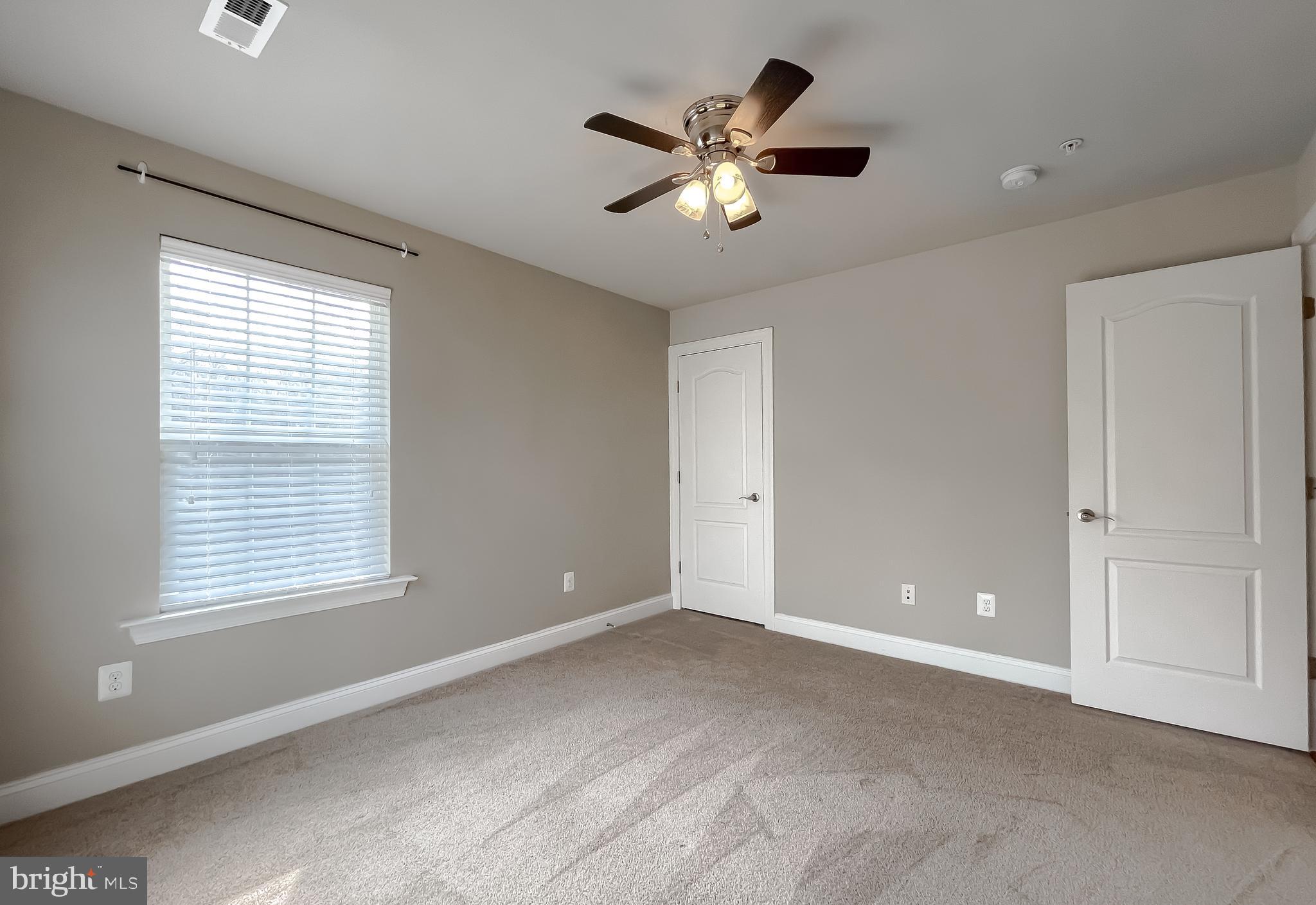 43361 Quail Street Hollywood, MD 20636 - Photo 32 of 73 a view of an empty room with chandelier fan and fire place