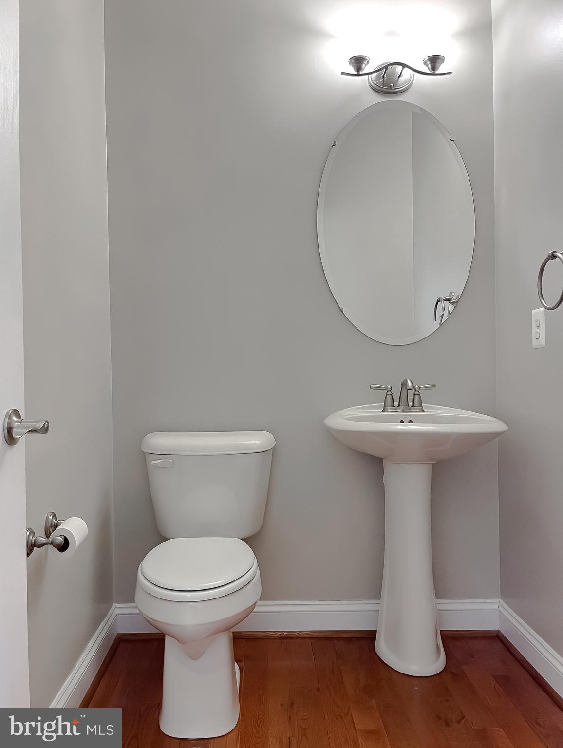 43361 Quail Street Hollywood, MD 20636 - Photo 33 of 73 a bathroom with a toilet sink and mirror