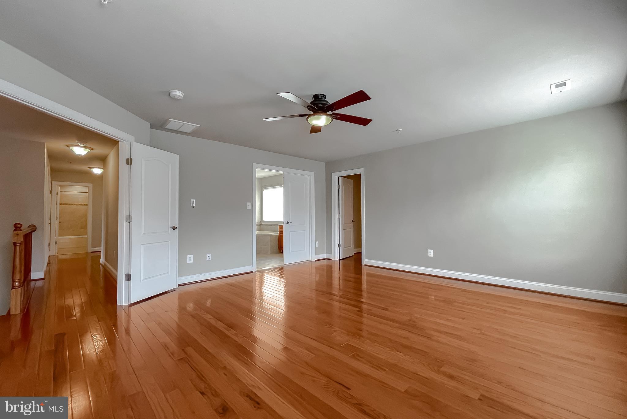 43361 Quail Street Hollywood, MD 20636 - Photo 39 of 73 a view of an empty room with window and wooden floor