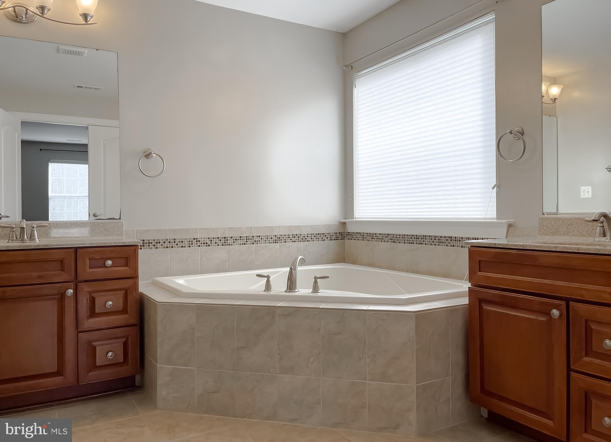 43361 Quail Street Hollywood, MD 20636 - Photo 43 of 73 a bathroom with a bathtub and a sink