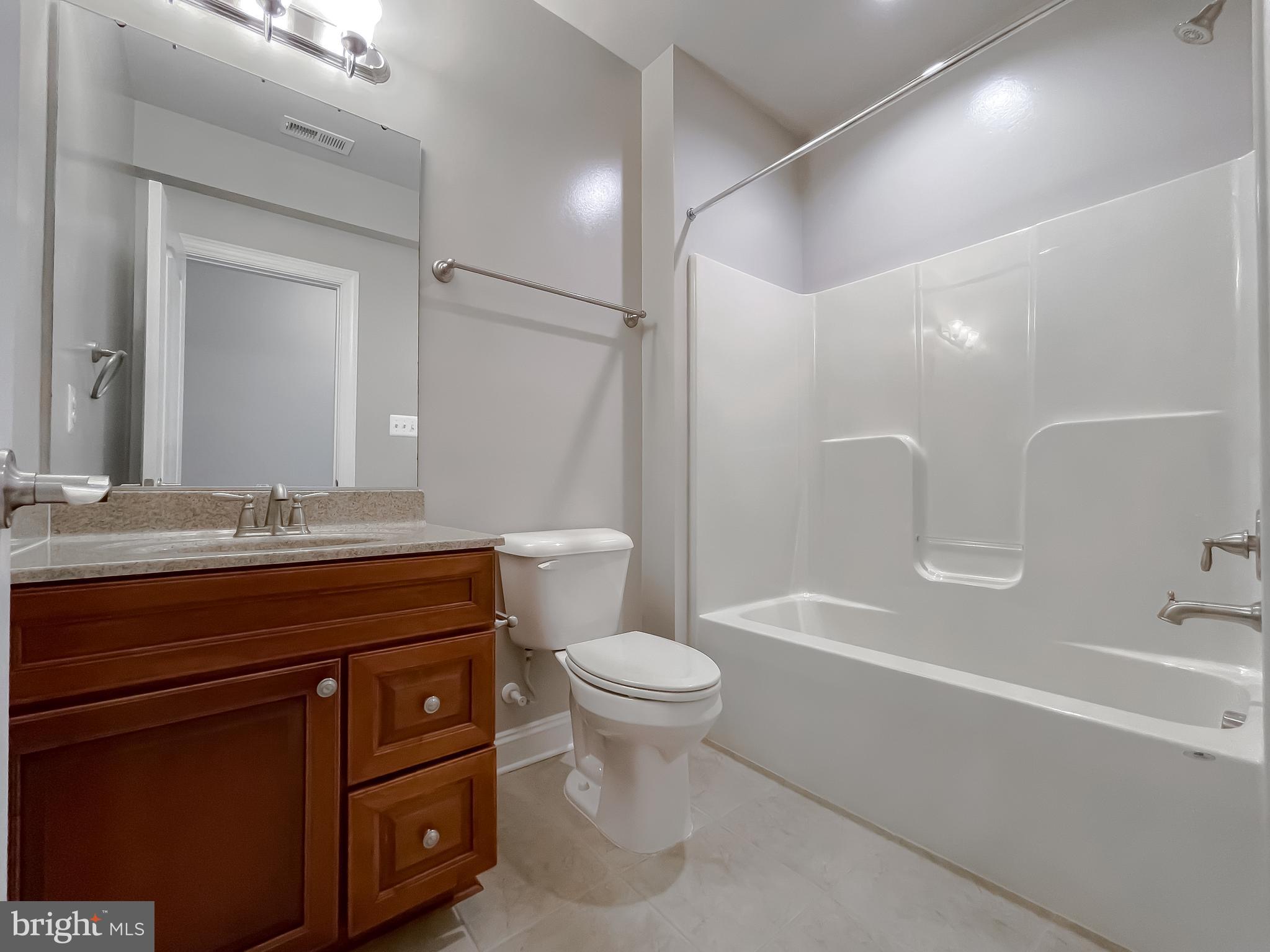 43361 Quail Street Hollywood, MD 20636 - Photo 51 of 73 a bathroom with a sink a toilet and a bathtub