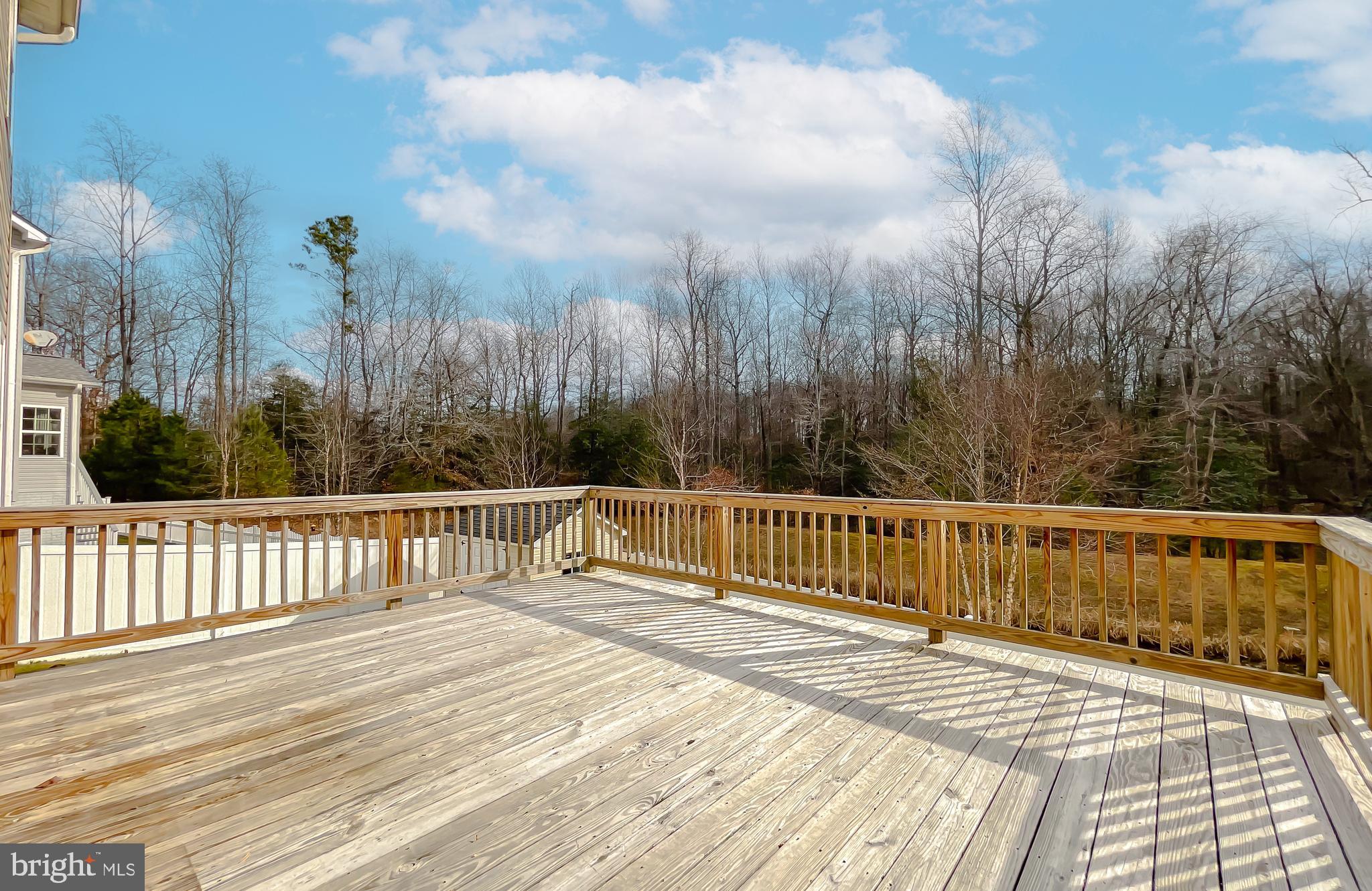 43361 Quail Street Hollywood, MD 20636 - Photo 59 of 73 a view of balcony with wooden floor and fence and trees