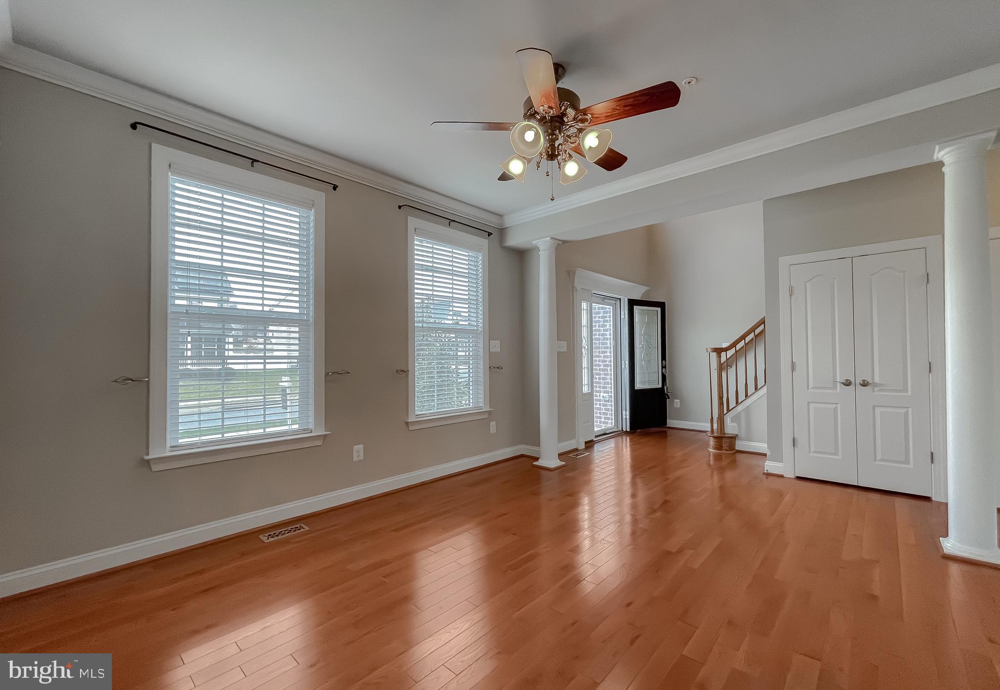 43361 Quail Street Hollywood, MD 20636 - Photo 7 of 73 a view of an empty room with wooden floor and a window